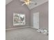 Neutral bedroom with vaulted ceiling, large window and closet at 1805 Hunters Moon Dr, Alpharetta, GA 30005