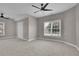 Spacious bedroom featuring neutral paint, carpet, and ceiling fan at 1805 Hunters Moon Dr, Alpharetta, GA 30005