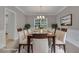 Staged dining room with table, chairs, and elegant chandelier at 1805 Hunters Moon Dr, Alpharetta, GA 30005