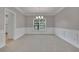 Unfurnished dining room featuring decorative wall trim, neutral carpeting, and a chandelier at 1805 Hunters Moon Dr, Alpharetta, GA 30005