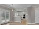 Modern kitchen with double doors and views of the living room at 1805 Hunters Moon Dr, Alpharetta, GA 30005