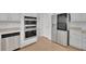 Modern kitchen with stainless steel appliances and white cabinets at 1805 Hunters Moon Dr, Alpharetta, GA 30005