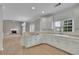 Kitchen and Living Room with white cabinets at 1805 Hunters Moon Dr, Alpharetta, GA 30005
