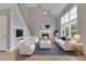 Inviting living room with modern decor, fireplace, and large windows at 1805 Hunters Moon Dr, Alpharetta, GA 30005