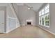 Bright living room with fireplace and built-in shelves with staircase at 1805 Hunters Moon Dr, Alpharetta, GA 30005