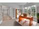 Bright home office with French doors and a wooden desk at 1805 Hunters Moon Dr, Alpharetta, GA 30005