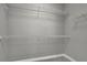 The walk-in closet is equipped with sturdy wire shelving providing ample space for organizing clothes and accessories at 1805 Hunters Moon Dr, Alpharetta, GA 30005
