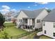 A fenced backyard features a deck with stairs and a covered patio area for outdoor living and entertaining at 322 Woodridge Pass, Canton, GA 30114