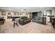 Finished basement with an open concept offers a comfortable living room and a pool table for entertainment at 322 Woodridge Pass, Canton, GA 30114