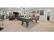 Finished basement features a pool table and a spacious lounge area with a large screen television at 322 Woodridge Pass, Canton, GA 30114
