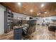 Finished basement boasts wood plank ceiling, modern floors, and ample space for a home office and gym at 322 Woodridge Pass, Canton, GA 30114