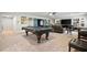 Finished basement offers a pool table, entertainment area, and comfortable seating for relaxation at 322 Woodridge Pass, Canton, GA 30114