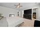 Large bedroom with great natural light includes a tv and ensuite bathroom for convenience at 322 Woodridge Pass, Canton, GA 30114