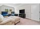 Bedroom featuring two twin beds, television, sofa, and plenty of space at 322 Woodridge Pass, Canton, GA 30114