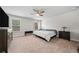 Bright bedroom features two windows and neutral colors offering a cozy and inviting atmosphere at 322 Woodridge Pass, Canton, GA 30114