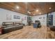 Finished bonus room with hardwood floors, wood ceiling, entertainment center, and ceiling fan at 322 Woodridge Pass, Canton, GA 30114