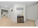 Neutral hallway with carpet, trimmed doors, and decorated display cabinet in a home's interior at 322 Woodridge Pass, Canton, GA 30114