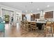 Bright kitchen with stainless appliances, granite counters, dark cabinets, bar stool seating and modern lighting at 322 Woodridge Pass, Canton, GA 30114