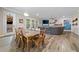 Bright, open-concept living space featuring hardwood floors, fireplace, and sliding glass doors to the backyard at 322 Woodridge Pass, Canton, GA 30114