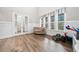 Cozy living room filled with natural light, featuring stylish French doors and modern flooring at 322 Woodridge Pass, Canton, GA 30114