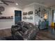 Comfortable living room with hard surface floors, a leather sofa, and decorative touches, perfect for relaxing at 322 Woodridge Pass, Canton, GA 30114