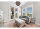 Cozy sitting area with natural light and view to outside patio with fireplace at 322 Woodridge Pass, Canton, GA 30114