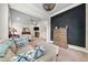 Main bedroom sitting area featuring a comfortable sofa and view to TV room at 322 Woodridge Pass, Canton, GA 30114
