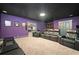 Finished basement offers a dedicated home theater room with plush seating for ultimate viewing comfort at 322 Woodridge Pass, Canton, GA 30114