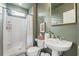 Fresh bathroom featuring a stand-up shower and decorative mirror at 1290 Nervi Nw Mews, Atlanta, GA 30318