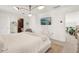 Bright bedroom featuring white walls, modern lighting, and a television at 1290 Nervi Nw Mews, Atlanta, GA 30318