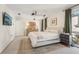 Bedroom features a comfortable bed, stylish decor, and a view of the outside at 1290 Nervi Nw Mews, Atlanta, GA 30318