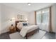 Cozy bedroom features a comfortable bed, plush rug, and natural light at 1290 Nervi Nw Mews, Atlanta, GA 30318