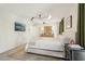 Light-filled bedroom features a comfortable bed, modern lighting, and stylish decor at 1290 Nervi Nw Mews, Atlanta, GA 30318