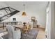 Dining area showcasing a wood table, modern decor, hardwood floors, and an open staircase at 1290 Nervi Nw Mews, Atlanta, GA 30318