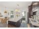 Open kitchen featuring modern appliances, a breakfast bar, and a view into the dining area at 1290 Nervi Nw Mews, Atlanta, GA 30318
