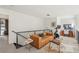 Well-lit living area featuring modern furniture and home gym equipment at 1290 Nervi Nw Mews, Atlanta, GA 30318