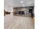 Finished basement featuring a stone fireplace, wood floors, and a pool table at 400 Simpson Ne Rd, White, GA 30184