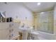 Bathroom featuring a vanity, tile floors, and a shower and tub combo with glass doors at 400 Simpson Ne Rd, White, GA 30184