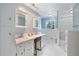 Bright bathroom featuring dual sinks, ample storage, and separate shower and tub areas with stylish tile work at 400 Simpson Ne Rd, White, GA 30184