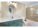 Bathroom with a vanity and a shower and tub combo with glass doors at 400 Simpson Ne Rd, White, GA 30184