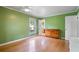 Spacious bedroom featuring wood floors, updated windows, and a ceiling fan at 400 Simpson Ne Rd, White, GA 30184