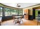 Cozy breakfast nook with large windows offering natural light and backyard views, complemented by hardwood floors at 400 Simpson Ne Rd, White, GA 30184