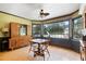 Bright dining area boasts ample natural light and views of the outdoor pool at 400 Simpson Ne Rd, White, GA 30184