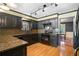 Beautiful kitchen with granite countertops, black cabinetry, and modern appliances at 400 Simpson Ne Rd, White, GA 30184