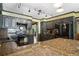 Modern kitchen featuring granite countertops, sleek black appliances, and custom cabinetry with stylish lighting at 400 Simpson Ne Rd, White, GA 30184