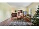 Comfortable living room showcases a cozy sofa, decorative rug, and a charming grand piano at 400 Simpson Ne Rd, White, GA 30184