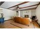 Comfortable living room with a fireplace, wood beam ceiling, and hardwood floors, perfect for relaxing at 400 Simpson Ne Rd, White, GA 30184