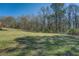 Lush, green backyard perfect for recreation, relaxation, or development at 1103 Wallington Nw Ct, Conyers, GA 30012