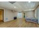 Spacious basement area with wood flooring and natural light from a window at 1103 Wallington Nw Ct, Conyers, GA 30012