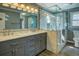 Bathroom featuring double sinks, granite counters, and glass enclosed shower at 1103 Wallington Nw Ct, Conyers, GA 30012